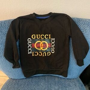 Kids GG black sweatshirt. See photos with measurements. Fits kids approx sz 5/6